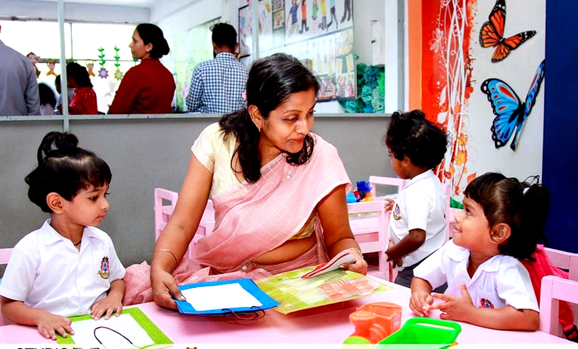 Teacher reading with nursery students
